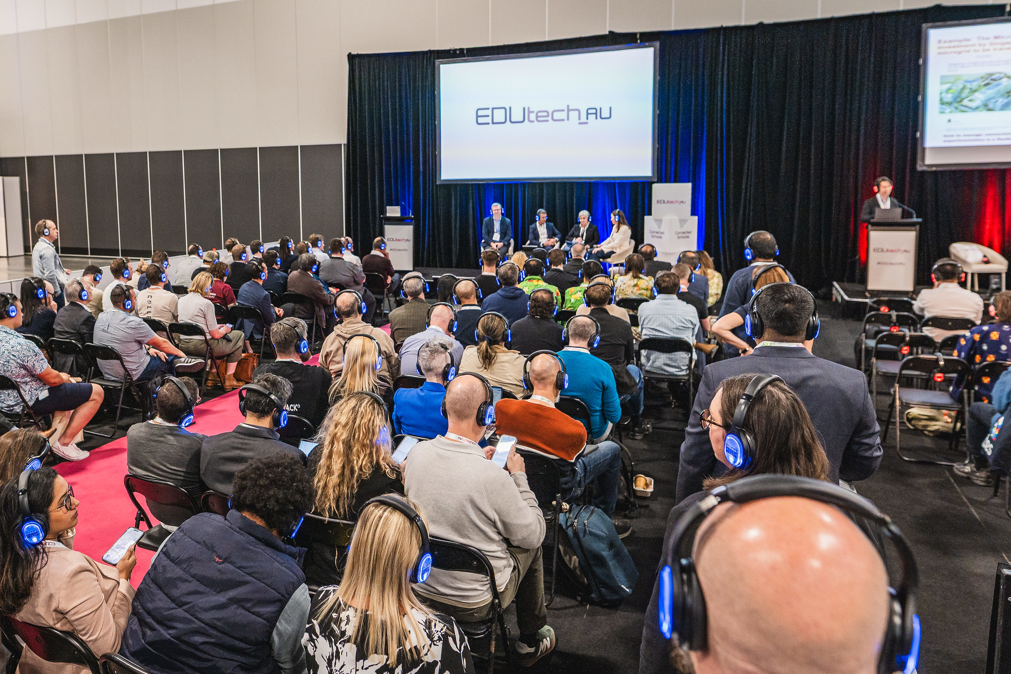 Audience members watching a panel discussion at EDUtech AU